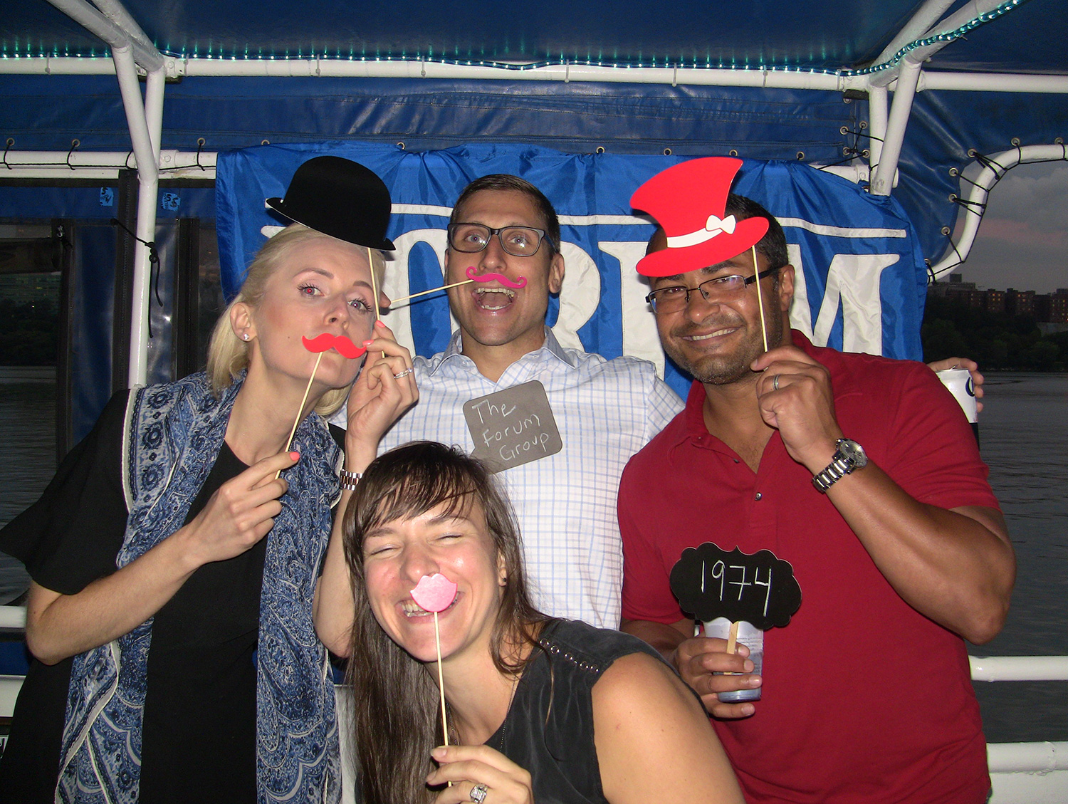 Photo: The Forum Group staff with photo booth props.