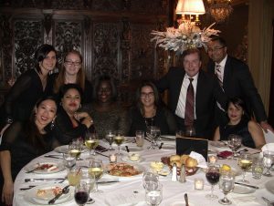 Photo: The Forum Group staff at a holiday event.